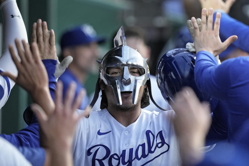 Kansas City Royals' Nick Pratto celebrates in the dugout after hitting a two-run home run during the fifth inning of a baseball game against the Chicago White Sox Wednesday, May 10, 2023, in Kansas City, Mo. (AP Photo/Charlie Riedel)