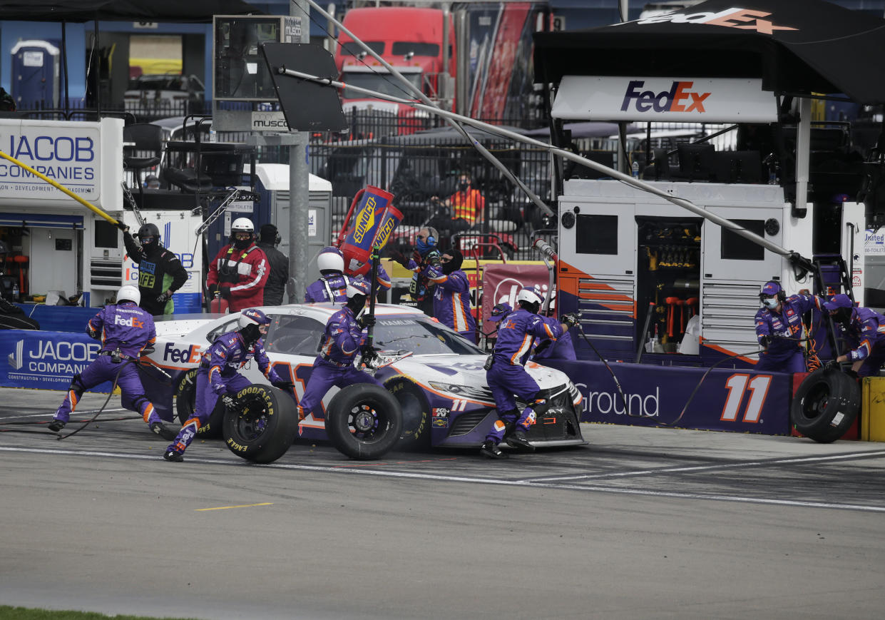 LAS VEGAS, NV - MARCH 07: Denny Hamlin, driver of the #11 Joe Gibbs Racing FedEx Ground Toyota Camry, makes a pit stop during the NASCAR Cup Series Pennzoil 400 race Sunday, March 7, 2021, in Las Vegas. (Marc Sanchez/Icon Sportswire via Getty Images)