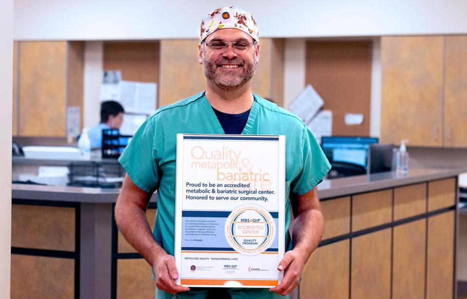 Thomas Smith, DO, with the certification of accreditation from the Metabolic and Bariatric Surgery Accreditation and Quality Improvement Program (MBSAQIP).