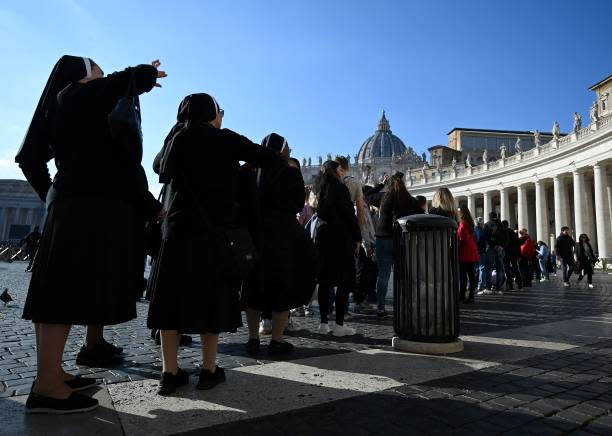 A group of nuns stand in line in St Peter’s Square at The Vatican on 28 December 2022 (AFP via Getty Images)