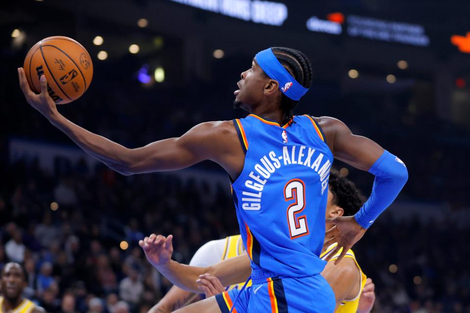 Oklahoma City Thunder guard Shai Gilgeous-Alexander (2) goes to the basket during an NBA basketball game between the Oklahoma City Thunder and the Los Angeles Lakers at Paycom Center in Oklahoma City, Thursday, Nov. 30, 2023.