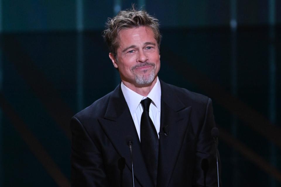 PARIS, FRANCE - FEBRUARY 24: Brad Pitt onstage while David Fincher receives the "Honorary César Award" during the 48th Cesar Film Awards at L'Olympia on February 24, 2023 in Paris, France. (Photo by Stephane Cardinale - Corbis/Corbis via Getty Images)