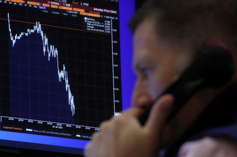 FILE PHOTO: Trader works on the floor of the NYSE in New York