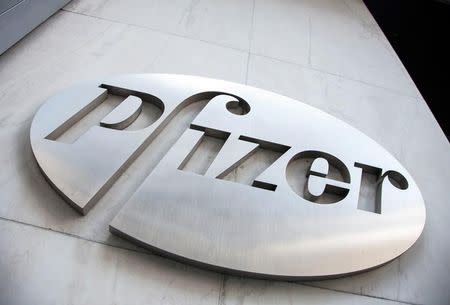 FILE PHOTO: The Pfizer logo is seen at their world headquarters in New York, U.S. April 28, 2014. REUTERS/Andrew Kelly/File Photo