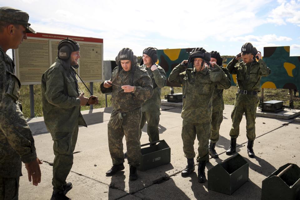 Recruits prepares to attend a military training at a firing range in the Krasnodar region in southern Russia, Tuesday, Oct. 4, 2022. Russian Defense Minister Sergei said that the military has recruited over 200,000 reservists as part of a partial mobilization launched two weeks ago. (AP Photo)