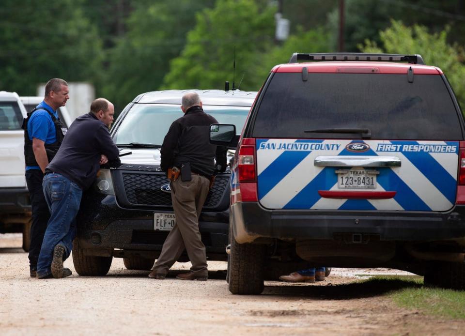 Law enforcement authorities responded to a scene where five people were shot the night before Saturday, April 29, 2023, in Cleveland, TX. Authorities say an 8-year-old child was among five people killed in a shooting at the home in southeast Texas late Friday night.