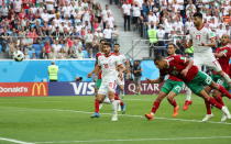 <p>St.petersburg (Russian Federation), 15/06/2018.- Aziz Bouhaddouz of Morocco (front) scores an own goal during the FIFA World Cup 2018 group B preliminary round soccer match between Morocco and Iran in St.Petersburg, Russia, 15 June 2018.<br>(RESTRICTIONS APPLY: Editorial Use Only, not used in association with any commercial entity – Images must not be used in any form of alert service or push service of any kind including via mobile alert services, downloads to mobile devices or MMS messaging – Images must appear as still images and must not emulate match action video footage – No alteration is made to, and no text or image is superimposed over, any published image which: (a) intentionally obscures or removes a sponsor identification image; or (b) adds or overlays the commercial identification of any third party which is not officially associated with the FIFA World Cup) (Mundial de Fútbol, Marruecos, Rusia) EFE/EPA/GEORGI LICOVSKI EDITORIAL USE ONLY </p>