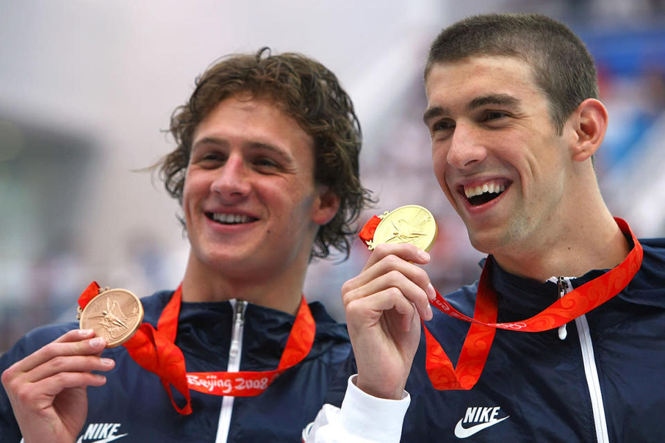 <p>Gold medalist Michael Phelps and bronze medalist Ryan Lochte (L) pose during the medal ceremony for the 200m individual medley final on August 15, 2008 in Beijing, China. Phelps won in a new world record time of 1.54.23. (Lars Baron/Bongarts/Getty Images)</p>