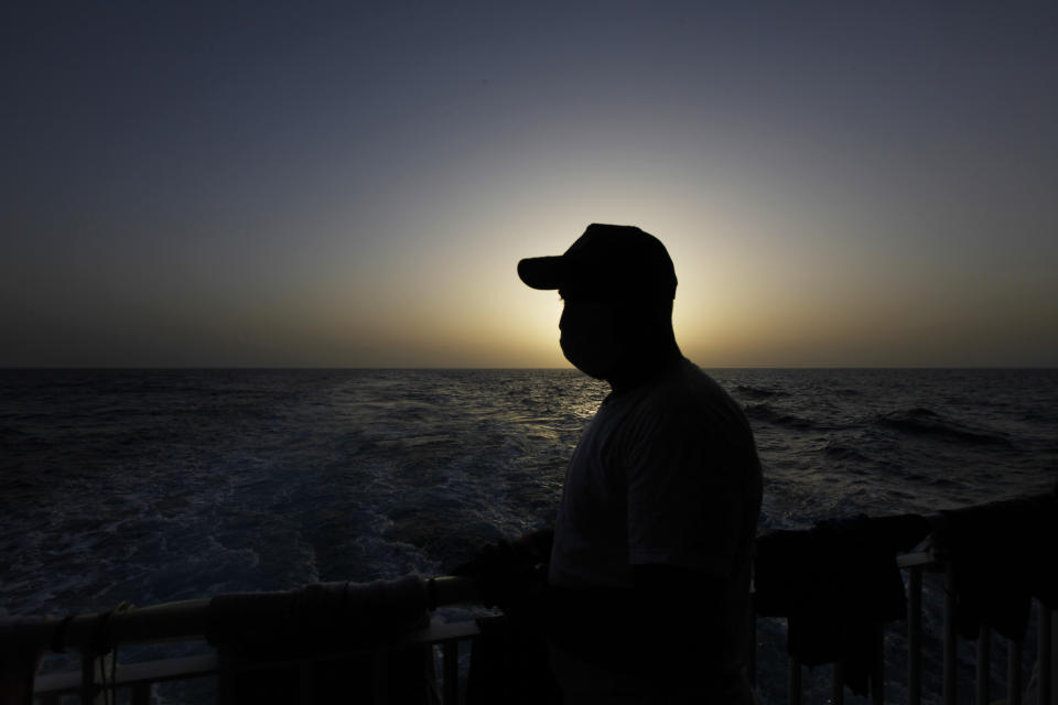 Waleed, a Tunisian migrant, looks at the Mediterranean Sea from the deck of the Geo Barents, a rescue vessel operated by MSF (Doctors Without Borders), Wednesday, Sept. 22, 2021. (AP Photo/Ahmed Hatem)