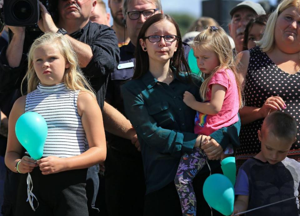 Mourners at a memorial for the 11 victims killed in the Shoreham air disaster (PA)