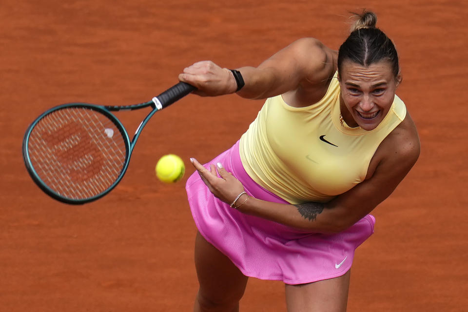 Aryna Sabalenka, of Belarusian, returns the ball to Magda Linette, of Poland, during the Mutua Madrid Open tennis tournament in Madrid, Friday, April 26, 2024. (AP Photo/Manu Fernandez)