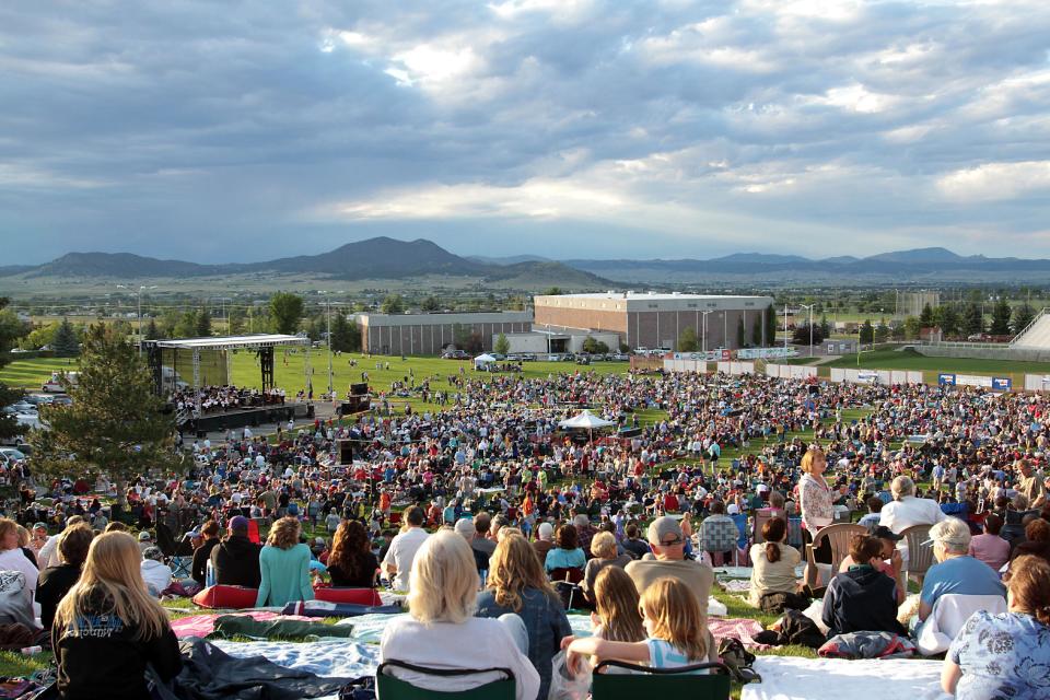 This 2012 photograph shows the crowd at the annual Symphony Under the Stars concert on the Carroll College lawn in Helena, Mont. The summertime event draws some 12,000 people and is one of a number of free things to do in Helena, Montana’s capital, which is located about halfway between Glacier and Yellowstone parks. This year’s concert takes place July 20. (AP Photo/Allen S. Lefohn)