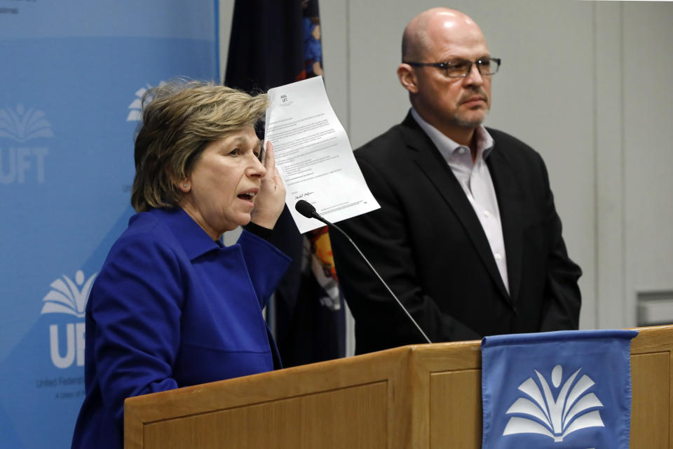 CORRECTS THAT WEINGARTEN IS PRESIDENT OF TEACHERS NOT UNITED FEDERATION OF TEACHERS - American Federation of Teachers President Randi Weingarten, and Michael Mulgrew, president of the United Federation of Teachers in New York City, address a news conference at UFT headquarters, in New York, Sunday, March 15, 2020. The New York City Council announced Sunday that it is suspending all hearings and meetings, but Mayor Bill de Blasio said he's still reluctant to shut down schools as other major U.S. cities have despite pressure from teachers to do so. (AP Photo/Richard Drew)