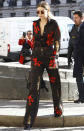 <p>Hadid made a major statement in a matching black shirt and top that were covered in bold red flowers.</p>