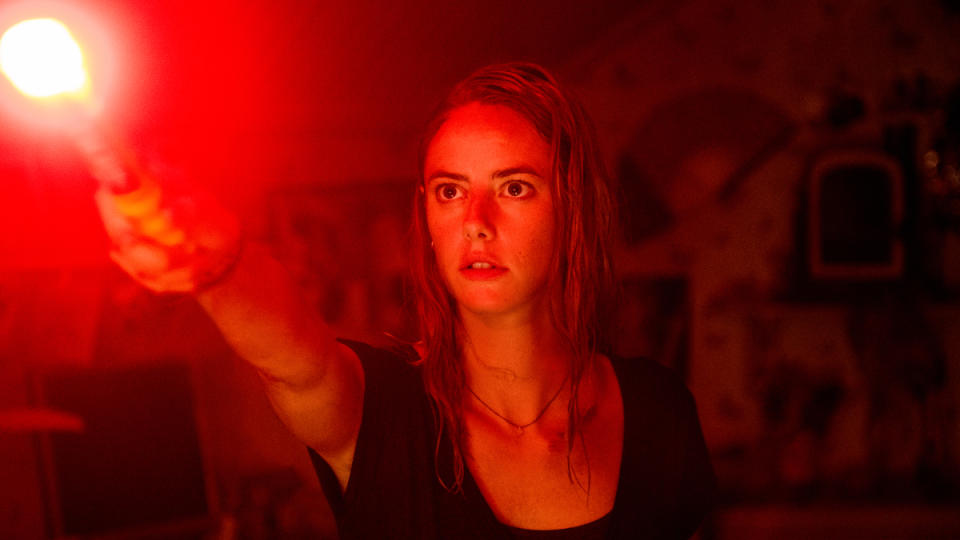 Kaya Scodelario defends her father and dog from rampaging alligators in horror movie 'Crawl'. (Credit: Paramount)