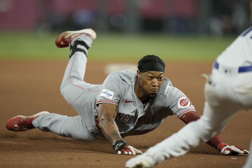 Cincinnati Reds' Will Benson is tagged out at third by Kansas City Royals third baseman Maikel Garcia after trying to advance on a double during the seventh inning of a baseball game Monday, June 12, 2023, in Kansas City, Mo. (AP Photo/Charlie Riedel)