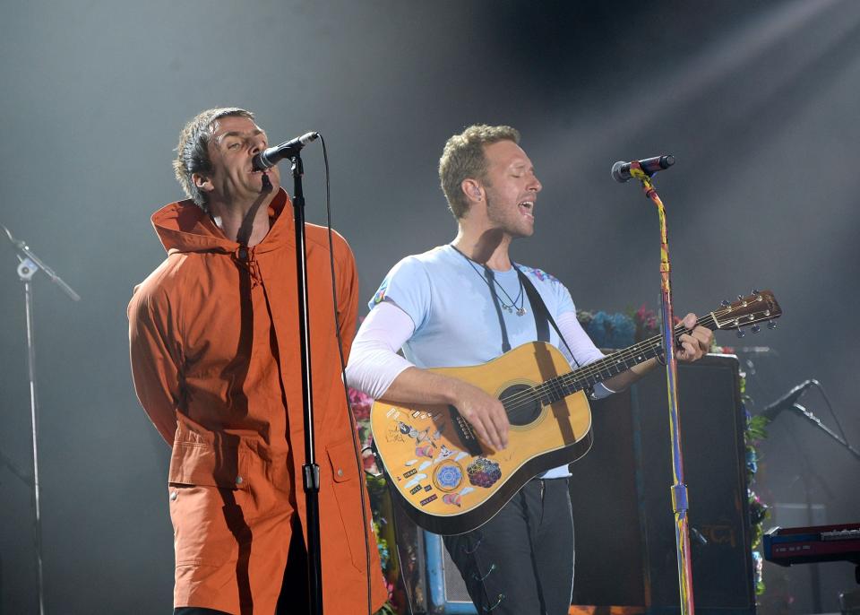 <p>Oasis frontman Liam Gallagher was joined on stage by Chris Martin during Live Forever. (Getty) </p>