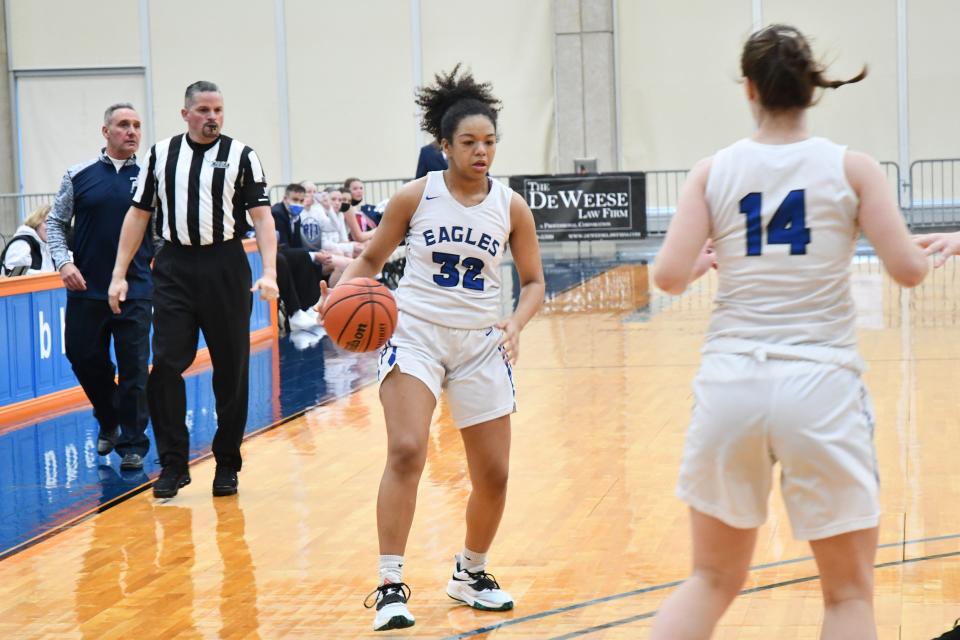 Paul VI forward Eva Andrews pauses at the 3-point line as forward Sarah McShea moves into the lane