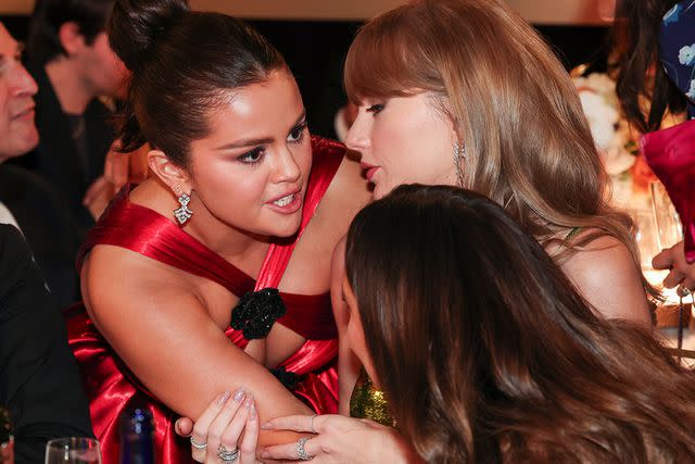 <p>Christopher Polk/Golden Globes 2024 via Getty Images</p> Selena Gomez and Taylor Swift at the Golden Globes