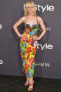 <p><strong>23 October</strong> Elle Fanning debuted for new choppy fringe at the awards wearing a colourful Versace dress.</p>