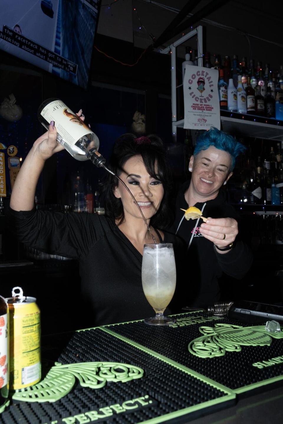 Freda Horton, left, and Lindsey Leavitt prepare one of their non-alcoholic cocktails, "Lady Business."