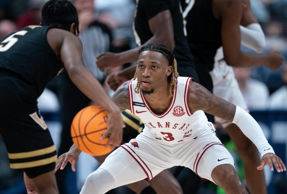 Arkansas Razorbacks guard El Ellis (3) guards Vanderbilt Commodores guard Ezra Manjon (5) during their first round game of the SEC Men's Basketball Tournament at Bridgestone Arena in Nashville, Tenn., Wednesday, March 13, 2024.