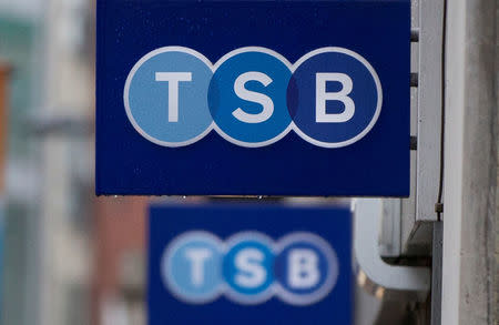 FILE PHOTO: Signs outside a branch of TSB bank in London May 27, 2014. REUTERS/Neil Hall