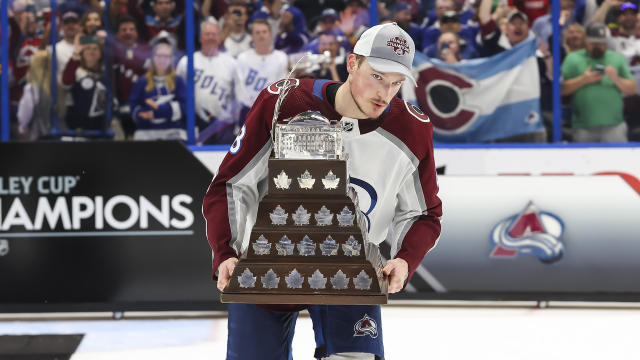 Cale Makar #8 of the Colorado Avalanche accepts the Conn Smythe trophy for Stanley Cup playoff MVP. (Photo by Mark LoMoglio/NHLI via Getty Images)
