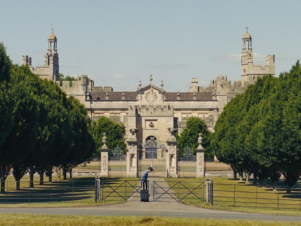 a person standing in front of a large building