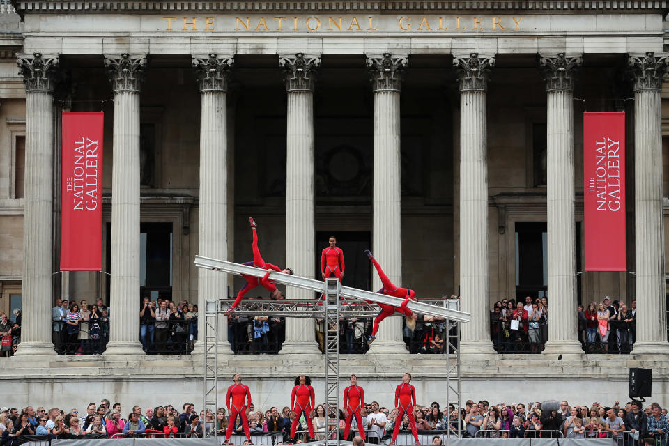 LONDON, ENGLAND - JULY 15: Dancers perform a routine in front of the National Gallery in Trafalgar Square as part of the 'One Extraordinary Day' performances on July 15, 2012 in London, England. The dancers are part of American choreographer Elizabeth Streb's 'Extreem Action' dance group which will perform around London for one day only and form part of the Cultural Olympiad. (Photo by Dan Kitwood/Getty Images)