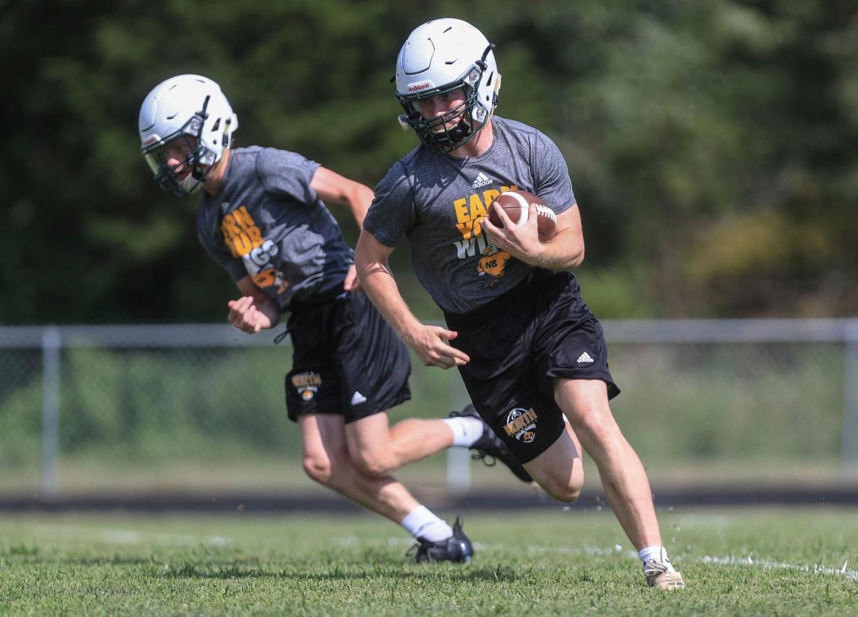 North Bullitt High School's football team practices during a recent hot August afternoon. The Eagles were 10-3 last year and 5-0 in their district. August 12, 2021 