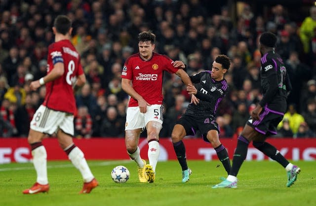 Manchester United’s Harry Maguire, centre left, pulls up before going off injured