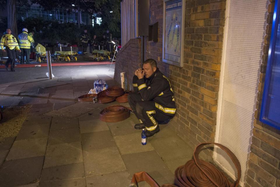 A distraught firefighter at the scene of the blaze (Jeremy Selwyn)