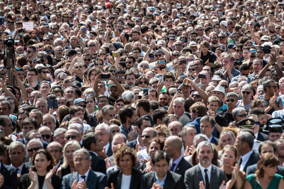 People gather in Pla&ccedil;a de Catalunya<i>&nbsp;</i>to observe a minute's silence for the victims.