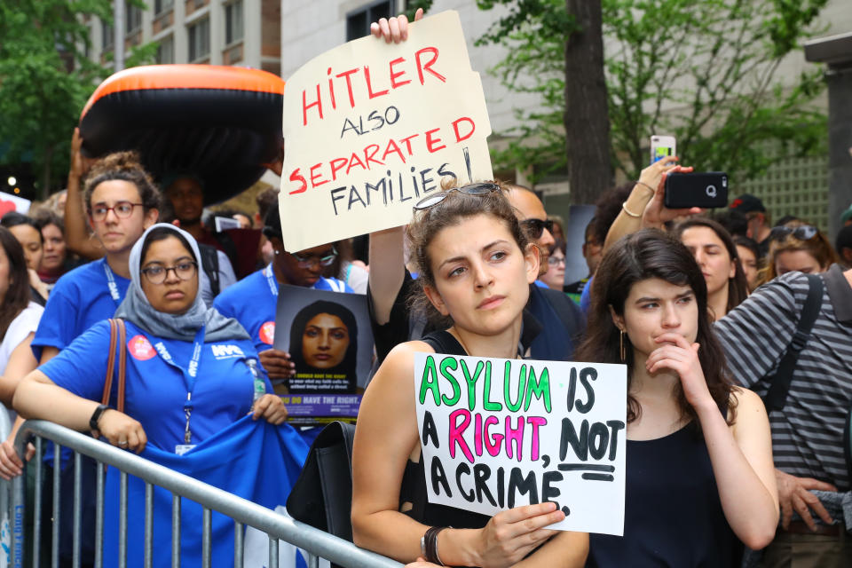 <p>A demonstrator holds up a sign with the names of people who died or were denied asylum in the U.S. in New York City on June 20, 2018. (Photo: Gordon Donovan/Yahoo News) </p>