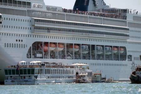 The cruise ship MSC Opera loses control and crashes against a smaller tourist boat at the San Basilio dock in Venice