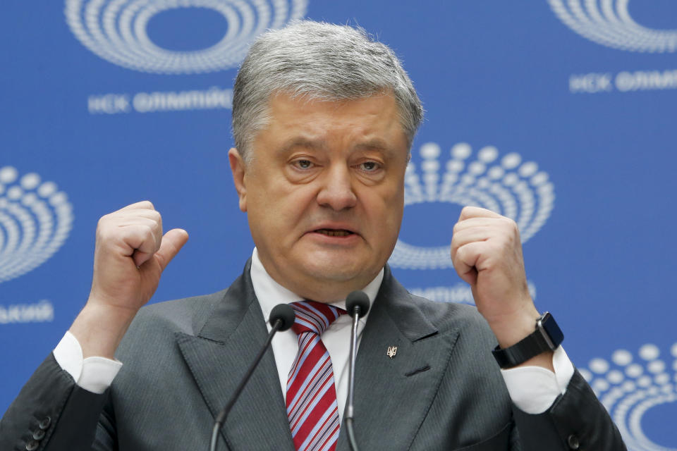 Ukrainian President Petro Poroshenko gestures while answering to a journalist's question ahead of the presidential elections on April 21, at the Olympic stadium in Kiev, Ukraine, Sunday, April 14, 2019. (AP Photo/Efrem Lukatsky)