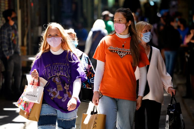 Shoppers walk down a city laneway after coronavirus disease restrictions were eased in Melbourne