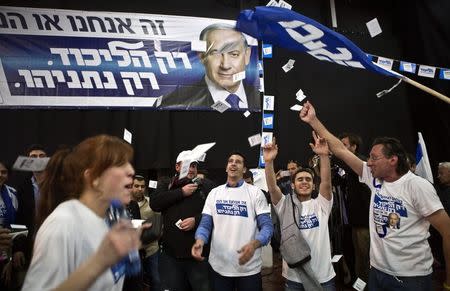 Likud party supporters react after hearing exit poll results in Tel Aviv March 17, 2015. REUTERS/Nir Elias