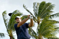 Patrick Reed hits from the 14th tee during the second round of the Sony Open PGA Tour golf event, Friday, Jan. 10, 2020, at Waialae Country Club in Honolulu. (AP Photo/Matt York)