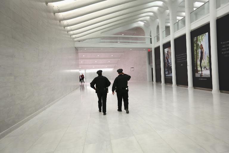 Police walk through the new World Trade Center West Concourse pedestrian transit connection on October 24, 2013 in New York City