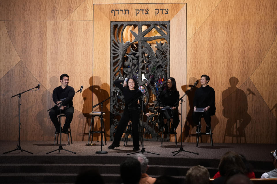 Lillian Mimi McKenzie, center, performs with other members of the cast in "What Do I Do With All This Heritage?" on Wednesday, May 22, 2024, in Los Angeles. The show offers more than 14 true stories of Asian American Jews. (AP Photo/Ashley Landis)