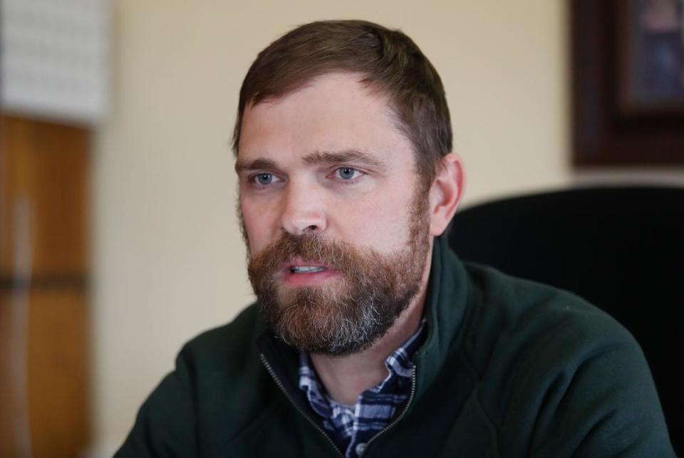 Roberts County Judge Mitchell Locke talks to visitors in his office. Residents have been working to recover from the Tues day grass fires that devastated parts of the panhandle.