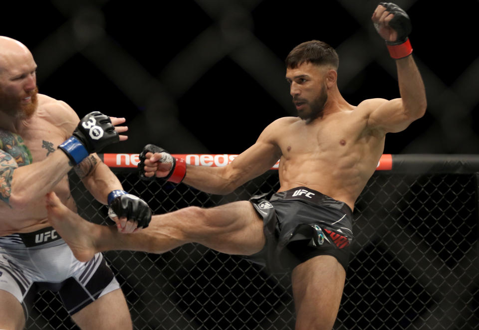 Feb 12, 2023; Perth, WA, AUSTRALIA; Yair Rodriguez (red gloves) fights Josh Emmett (blue gloves) during UFC 284 at RAC Arena. Mandatory Credit: Jasmin Frank-USA TODAY Sports