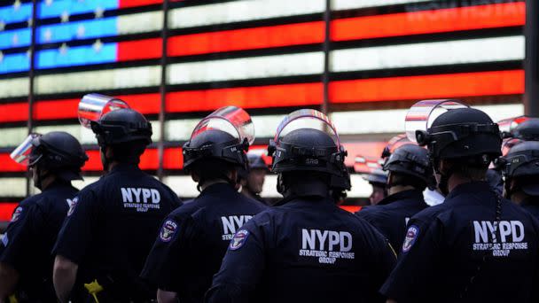 PHOTO: NYPD police officers watch demonstrators in Times Square in New York, June 1, 2020. (AFP via Getty Images, FILE)