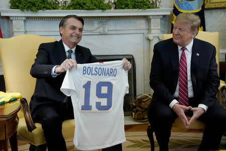 U.S. President Donald Trump meets with Brazilian President Jair Bolsonaro in Oval Office of the White House in Washington, U.S., March 19, 2019. REUTERS/Kevin Lamarque