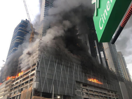 A fire is seen at a tower under construction in Dubai's Downtown district, United Arab Emirates April 2, 2017. Government of Dubai Media Office/Handout via REUTERS