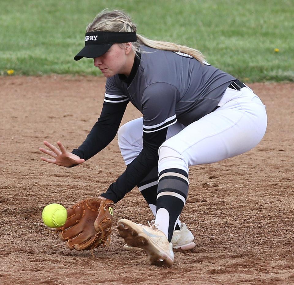 Delaney Ellis of Perry scoops up the ball before throwing to first for the out during their game at Tuslaw on Friday, April 22, 2022.