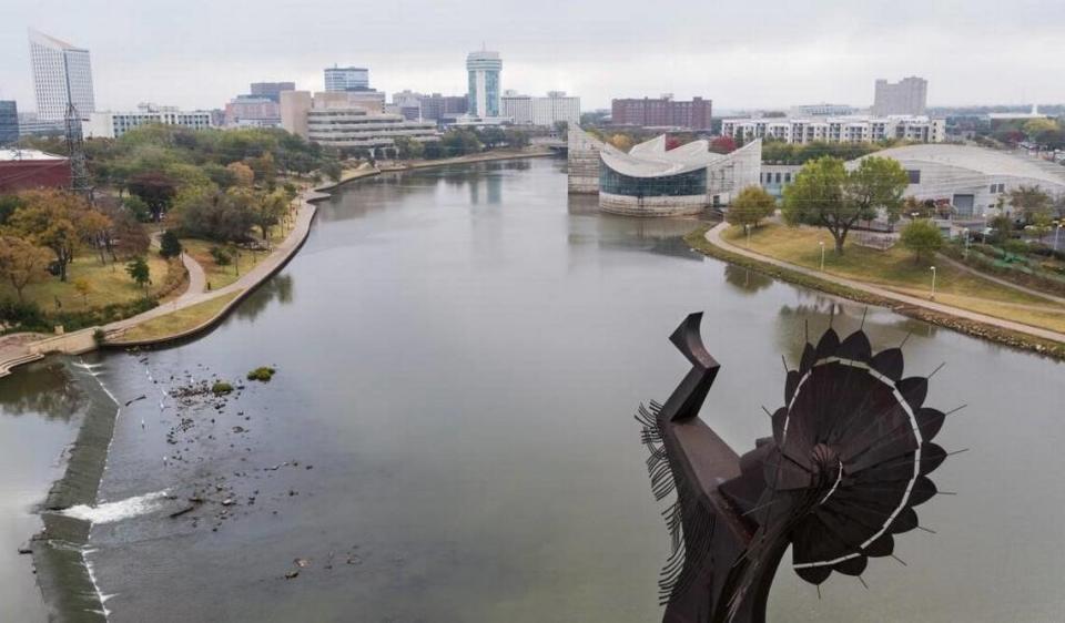 The Keeper of the Plains overlooking Exploration Place and downtown Wichita from its Riverside perch.