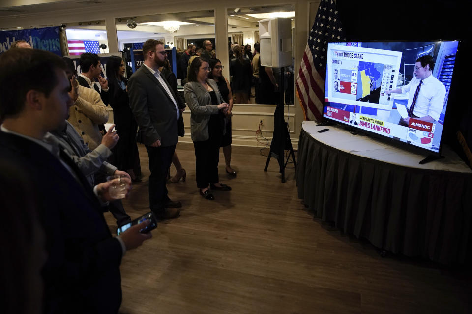 Supporters of U.S. Rep. Sean Patrick Maloney, D-N.Y., watch results come in at Maloney's election night party, Tuesday, Nov. 8, 2022, in Nyack, N.Y. Maloney chose to stay in Washington instead of attending the party. (AP Photo/Julia Nikhinson)